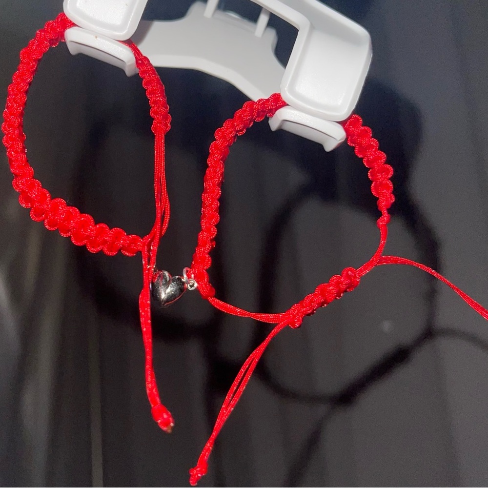 Couple red bracelets with heart magnet charms